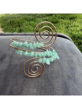 Aquamarine spiral cuff bracelet with gold wire and light blue chips